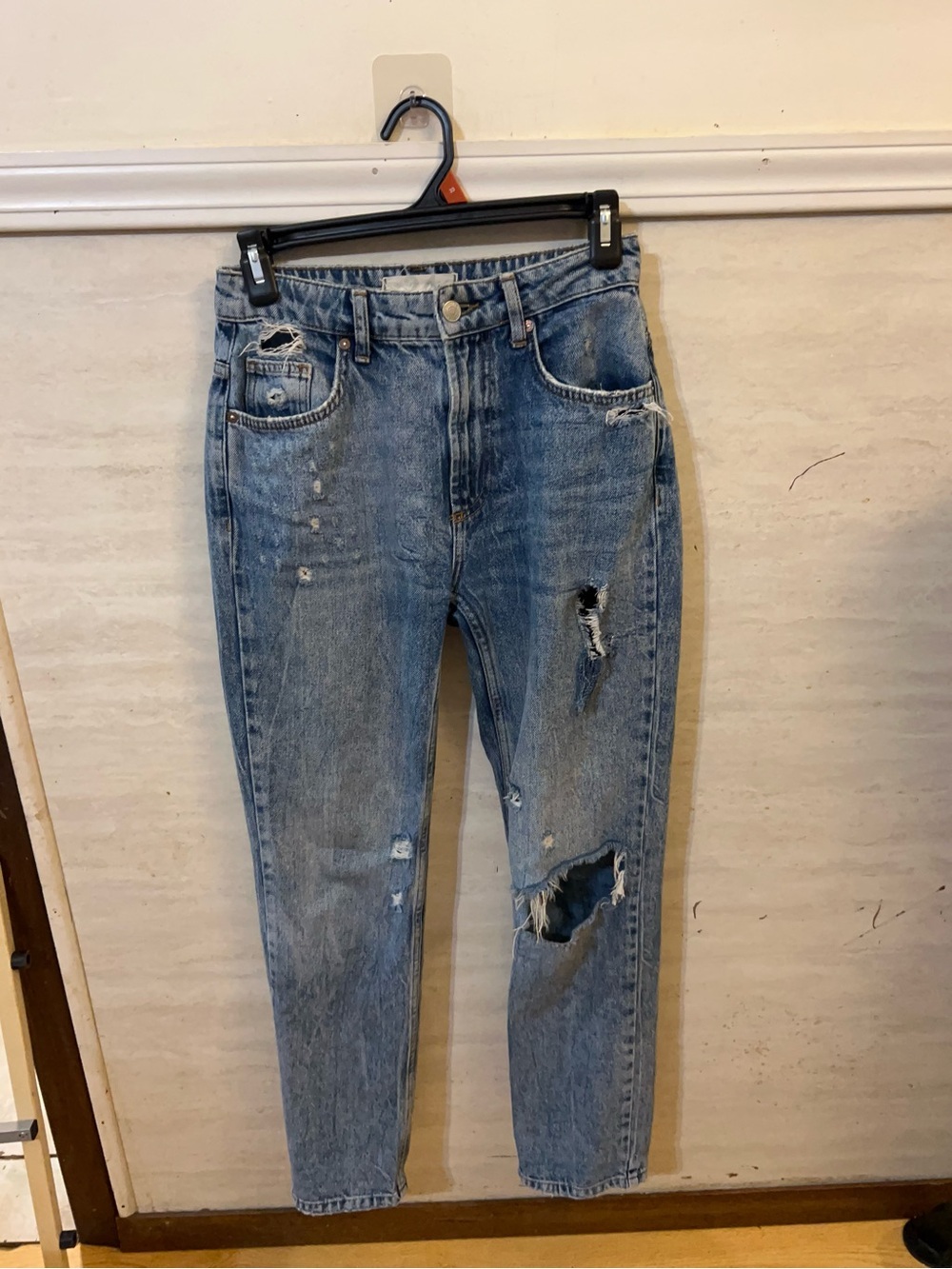 We The Free distressed straight-leg denim jeans by Free People.